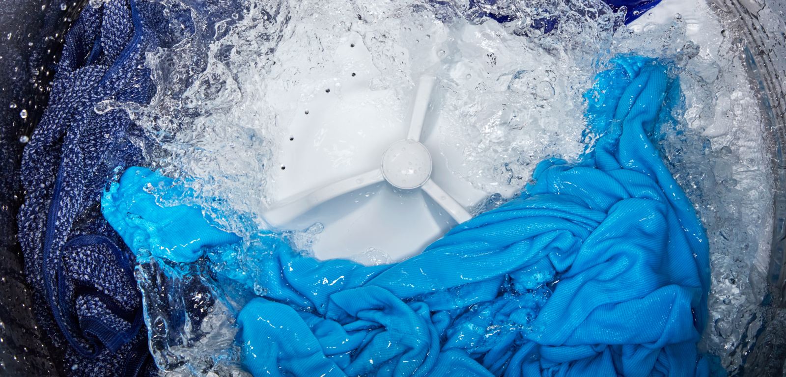 Interior of a washing machine mid-wash cycle.